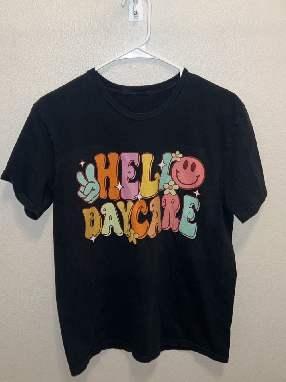 Amazon Black Short Sleeve Tee with Multicolor Retro 'HELLO DAYCARE' Graphic